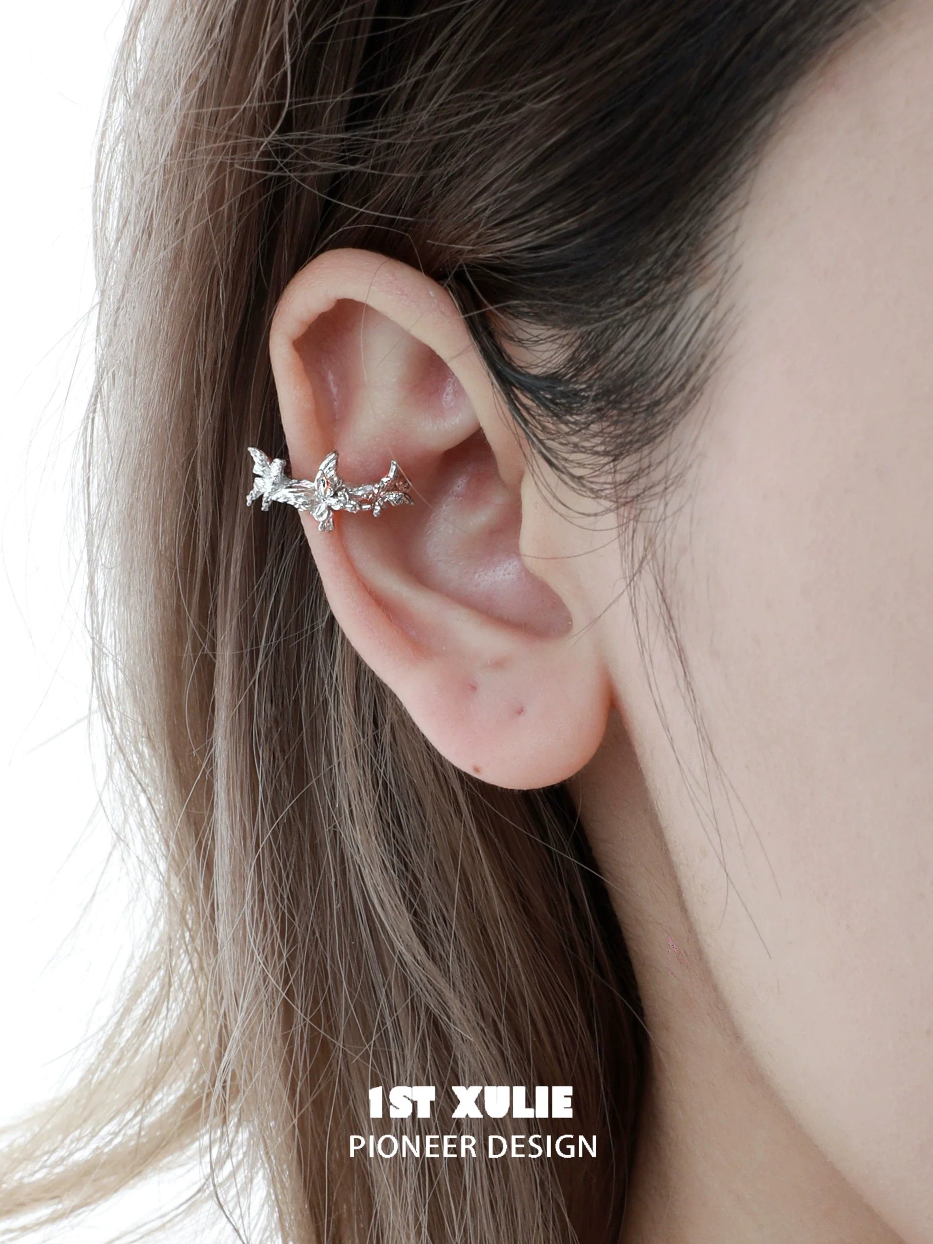 Silver butterfly ear cuff by 1STXULIE, featuring a delicate design that wraps around the ear