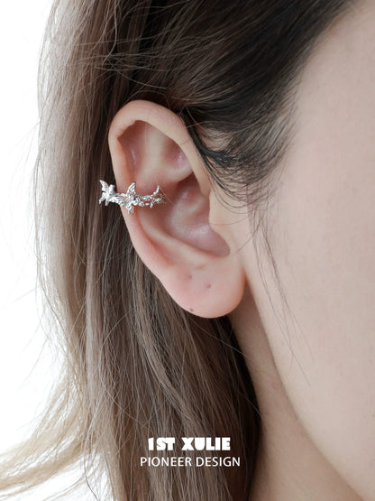 Silver butterfly ear cuff by 1STXULIE, featuring a delicate design that wraps around the ear