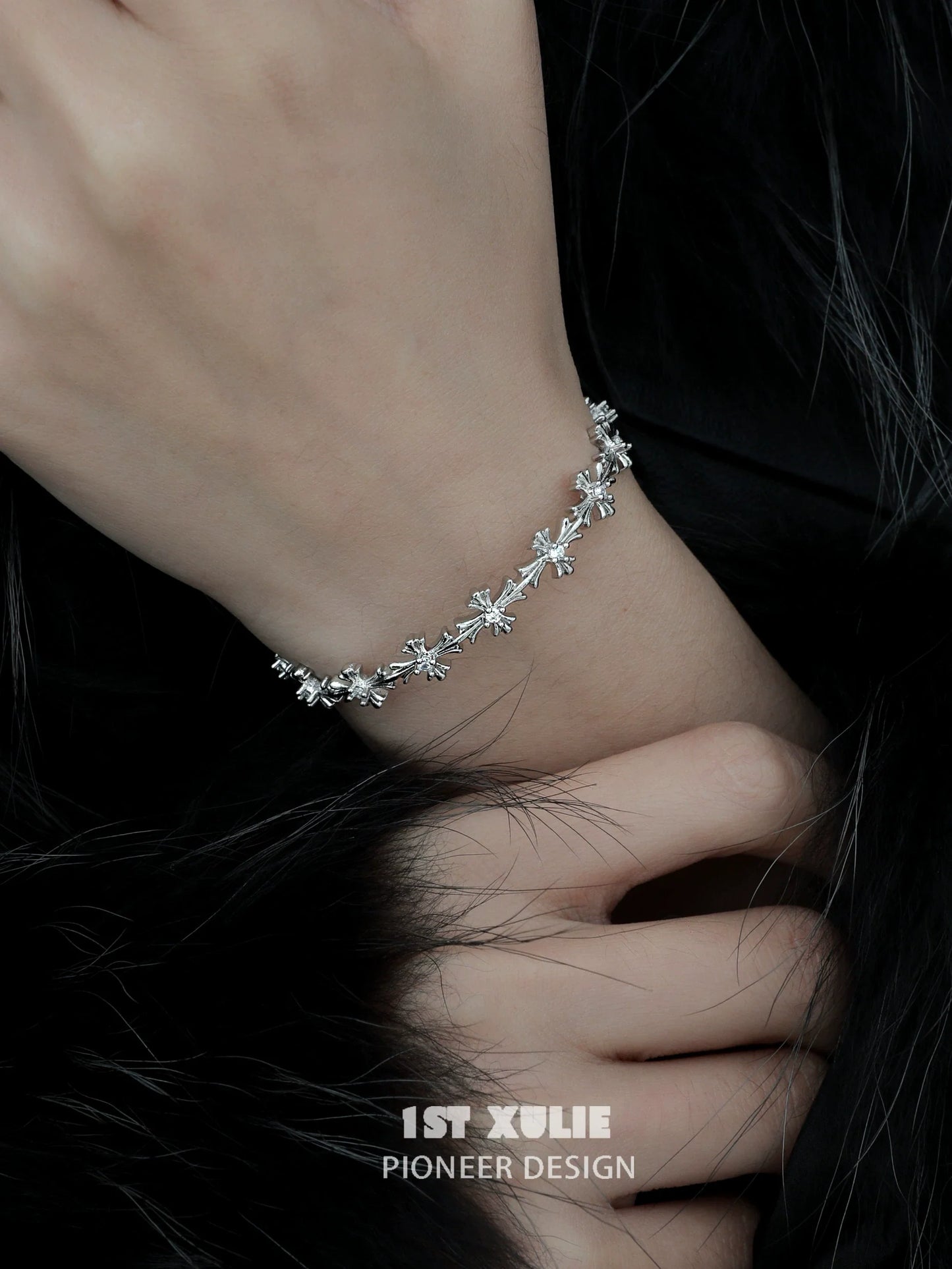 Elegant silver cross bracelet with delicate designs, perfect for everyday wear or special occasions