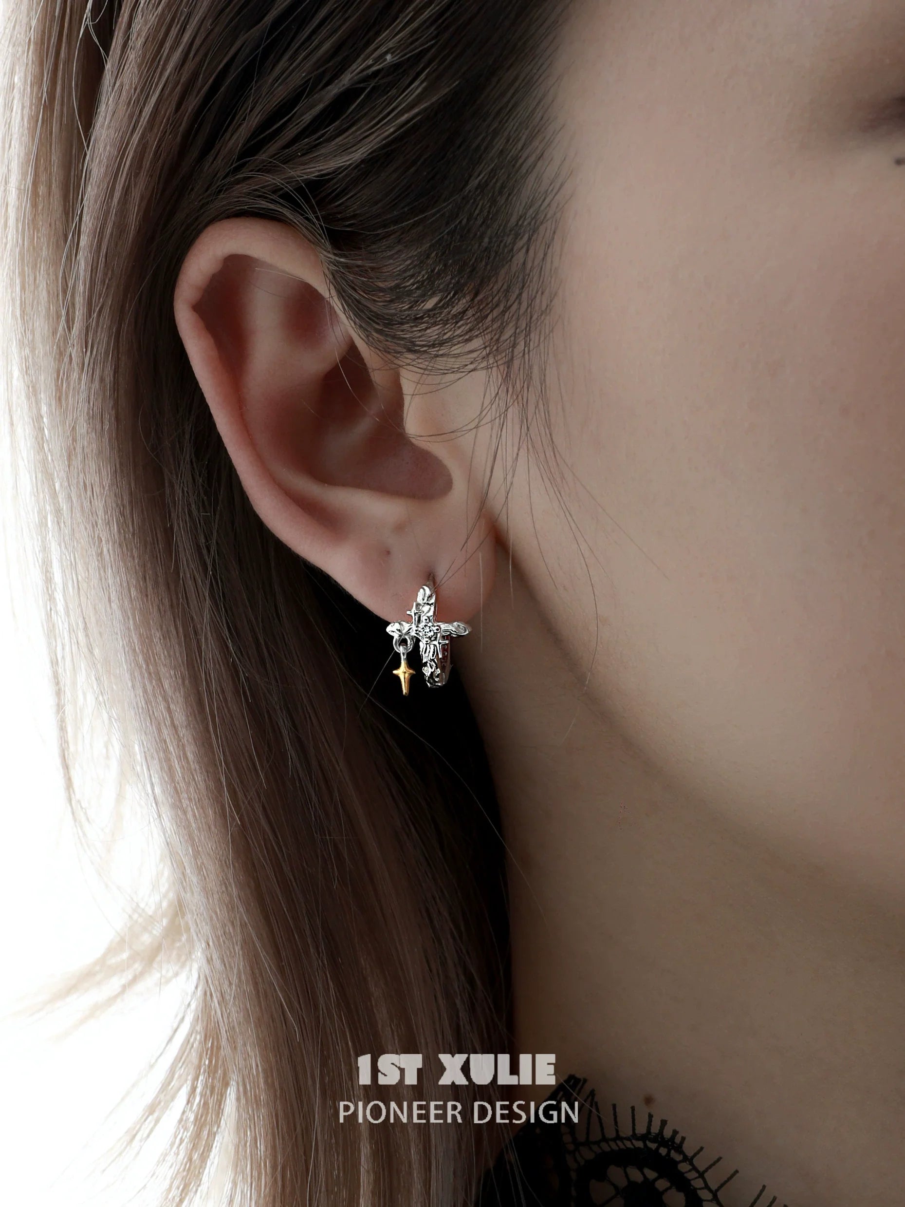 Stylish silver cross ear clips by 1STXULIE featuring intricate design and elegant look