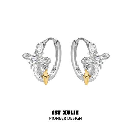 Silver Cross Ear Clips by 1STXULIE featuring a unique design with gold accents