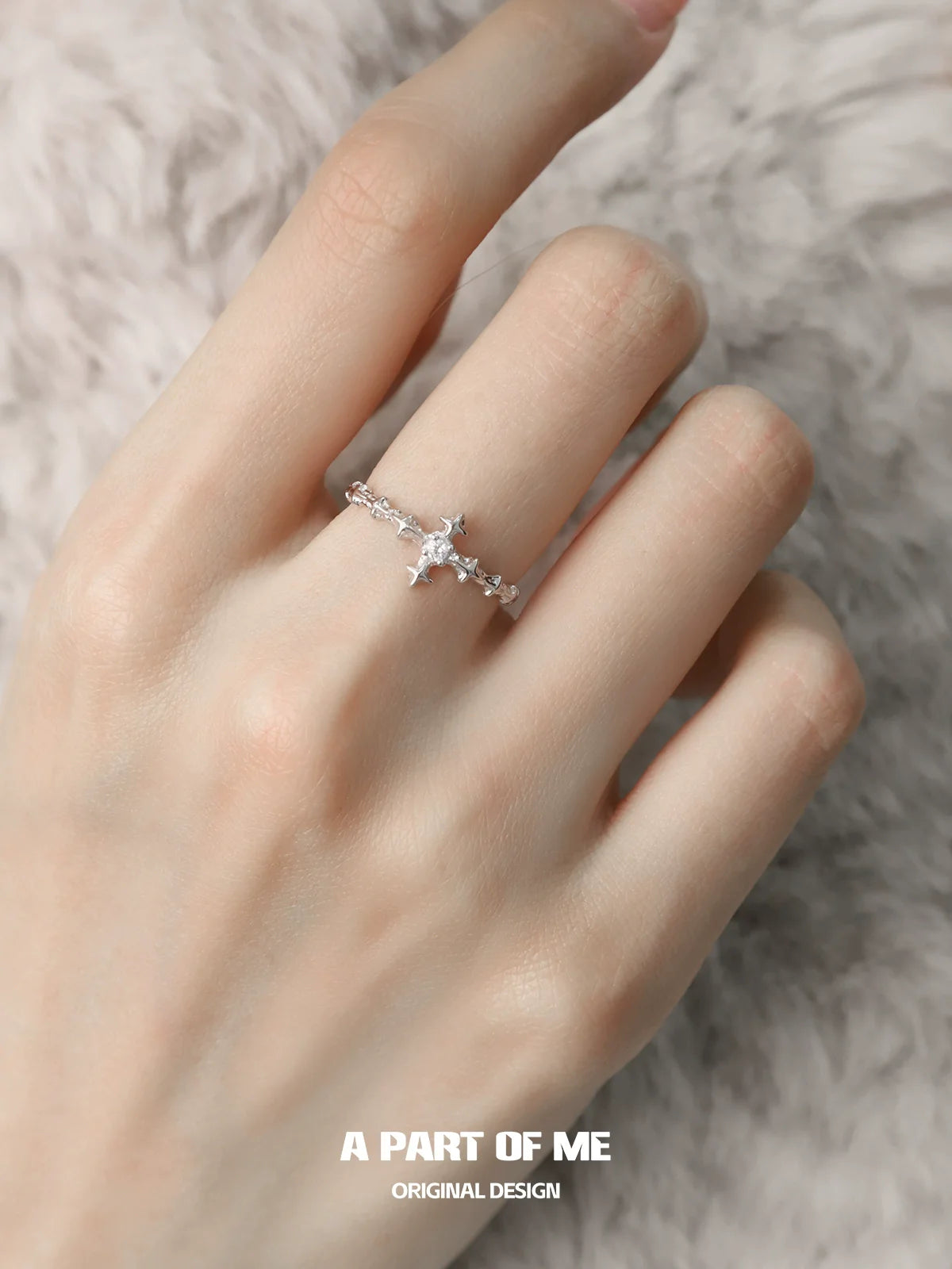 Elegant silver cross ring by A PART OF ME featuring a delicate design and sparkling accents