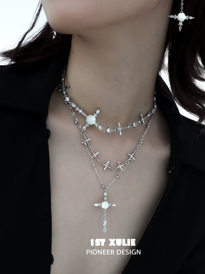 Elegant silver rose cross necklace layered with sparkling accents for a stylish look