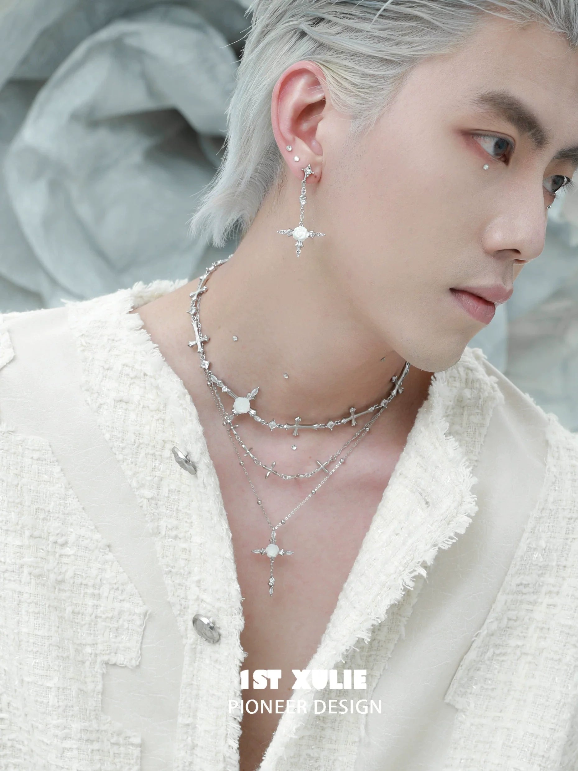 Stylish Model Wearing a Silver Rose Cross Necklace with Elegant Layered Design