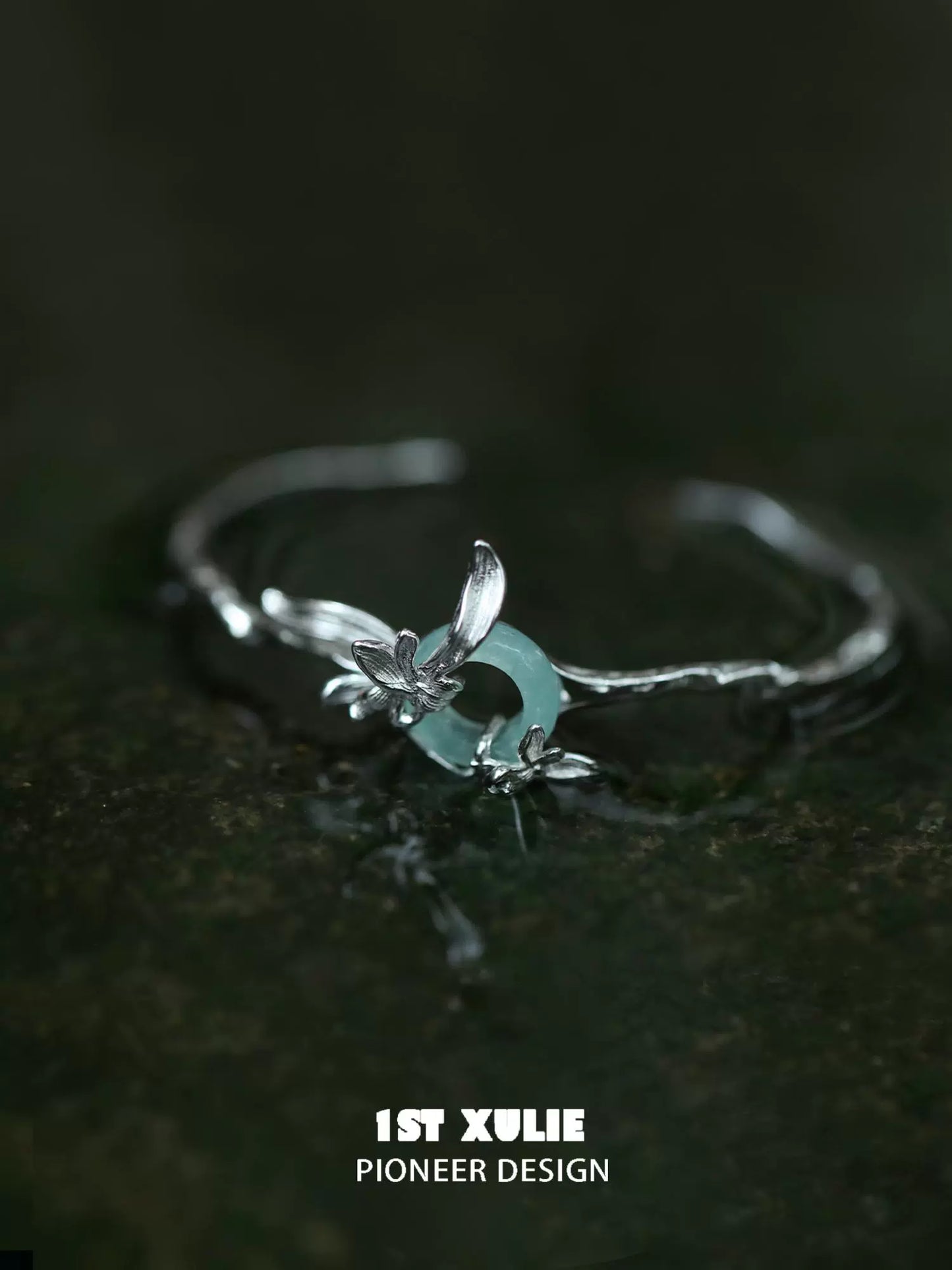 Elegant silver safety buckle bracelet with floral design and aqua accents for stylish wear