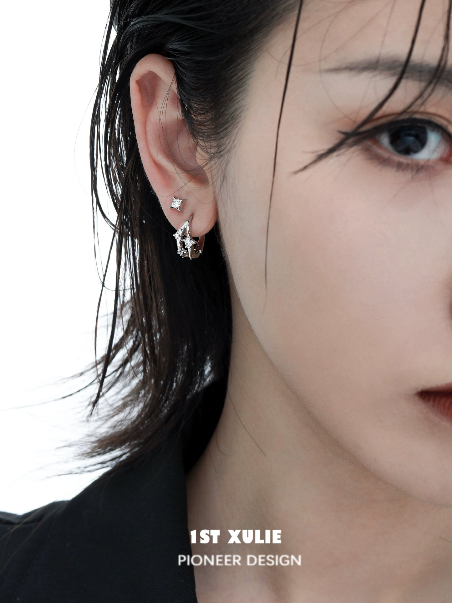Stylish 1STXULIE silver star ear cuff on a model showcasing elegant ear jewelry