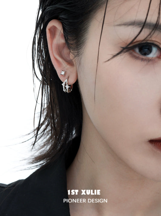 Stylish 1STXULIE silver star ear cuff on a model showcasing elegant ear jewelry