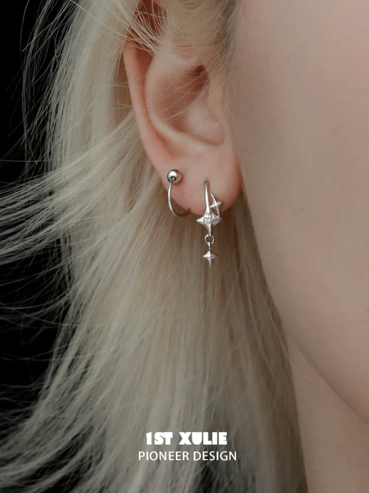 Delicate silver star earrings with unique design, perfect for everyday wear and special occasions