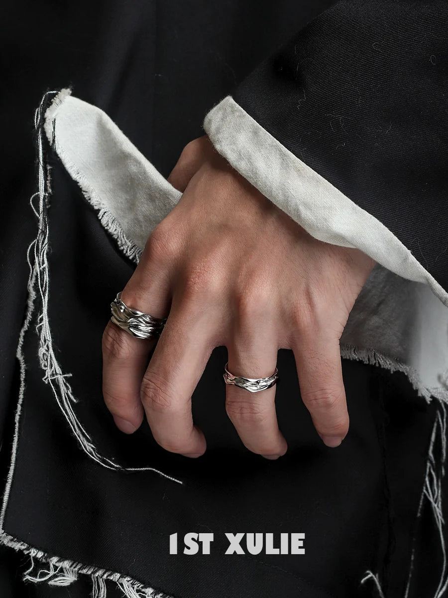 Stylish silver statement ring worn on hand with textured details and contemporary design by 1STXULIE