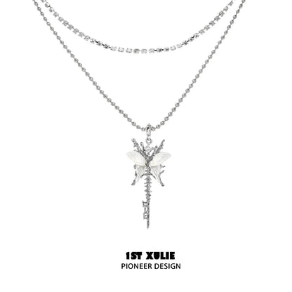 Skeleton butterfly pearl necklace by 1STXULIE featuring layered silver design with elegant embellishments