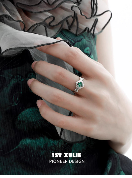 Elegant Slytherin green snake ring with a shimmering emerald and intricate silver detailing