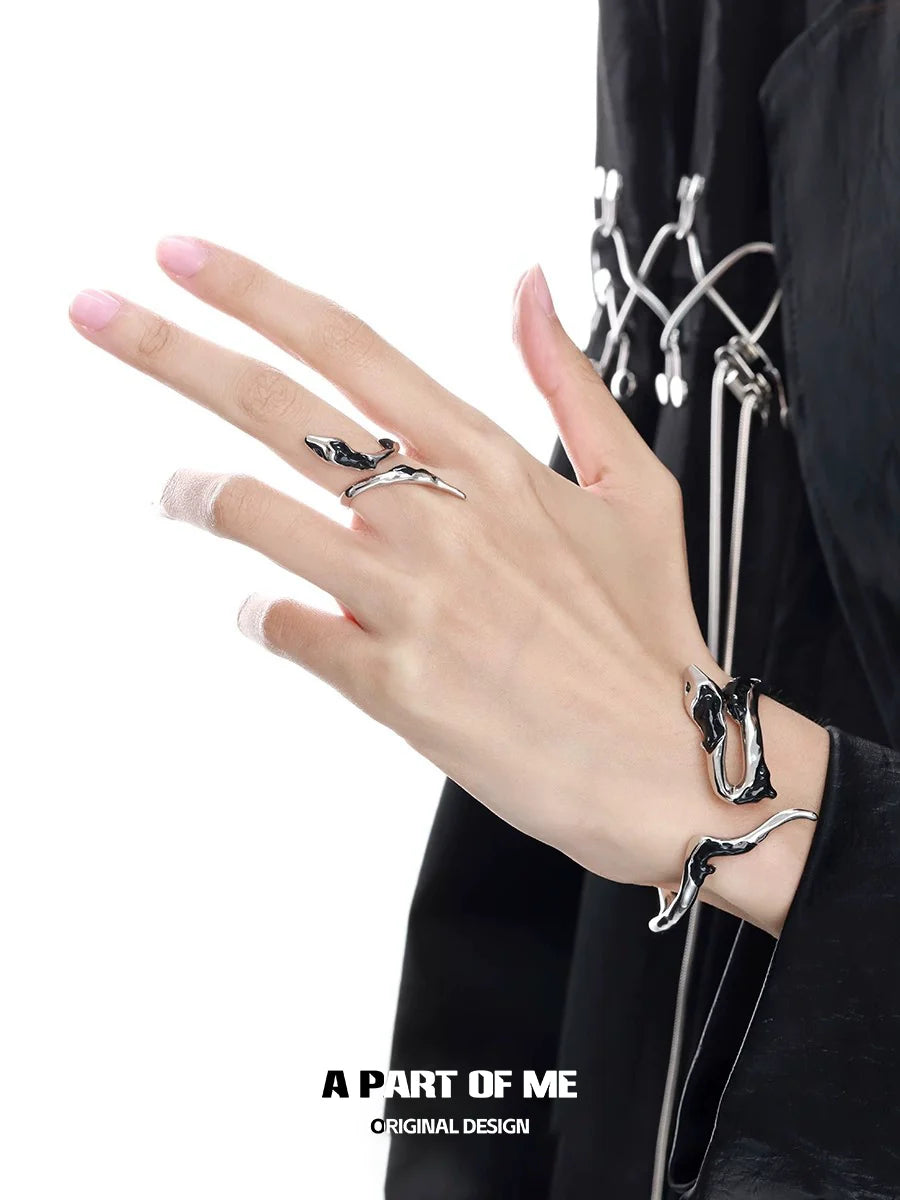 Slytherin inspired snake ring in silver on a model's hand, showcasing a unique design