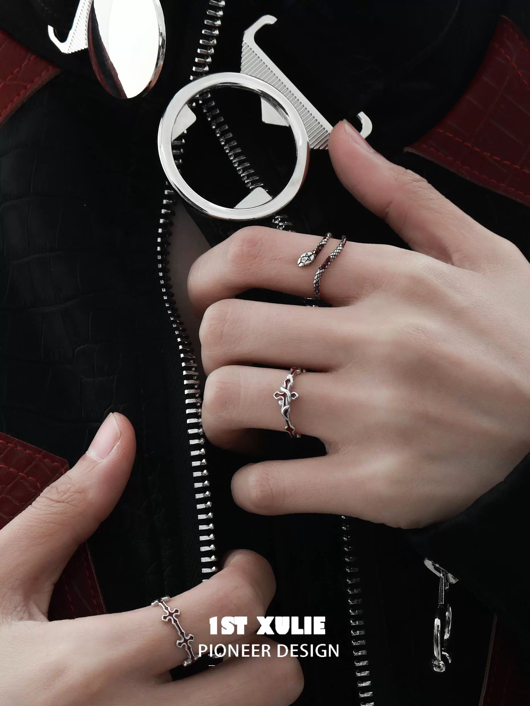 Slytherin snake couple rings in silver on a model's hands with stylish attire