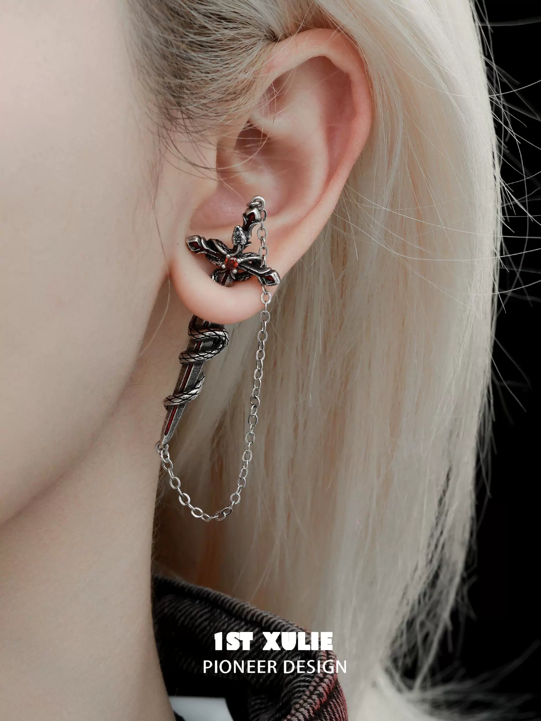 Stylish Slytherin snake earrings featuring chain detail for a unique look