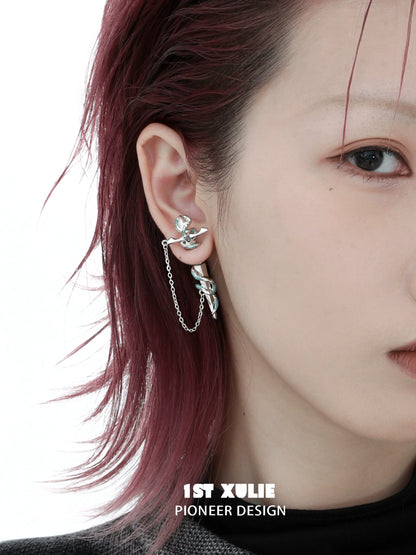 1ST XULIE snake chain piercing earrings in silver showcasing a unique and modern design