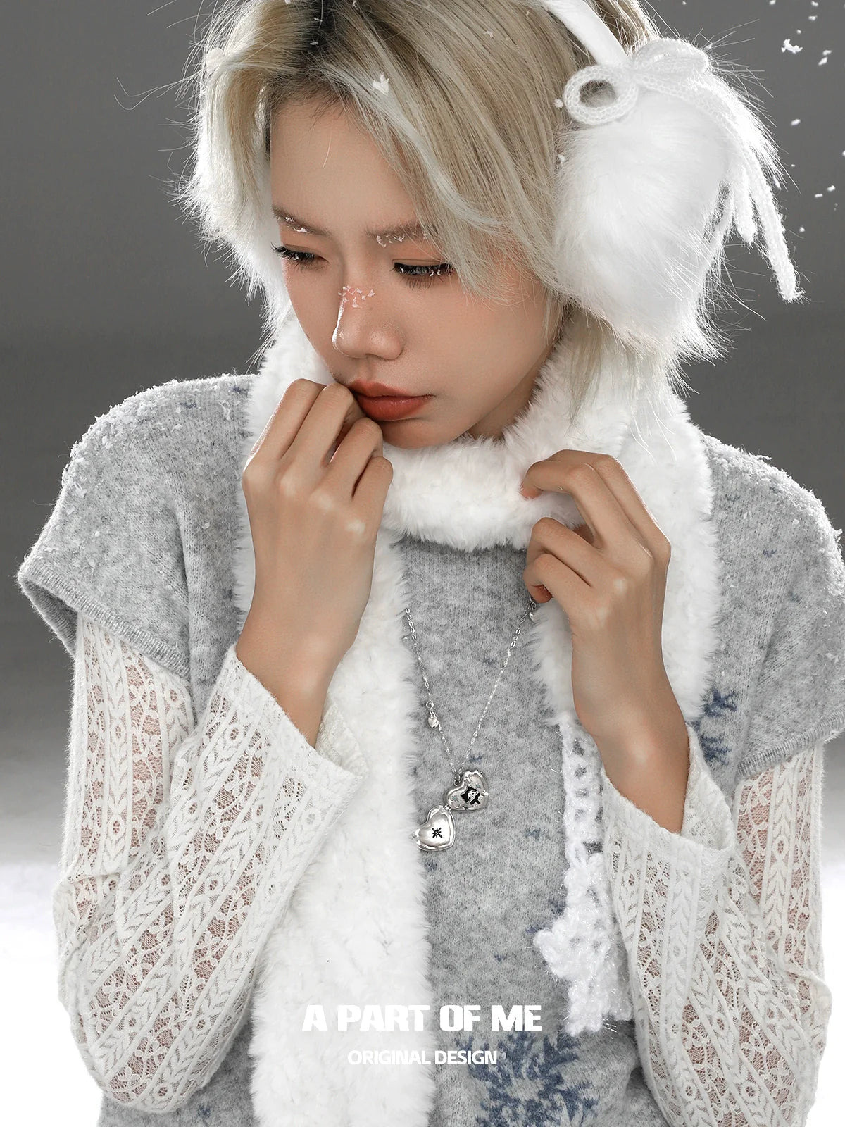 A PART OF ME snow kitten love pendant necklace worn by a model with winter attire