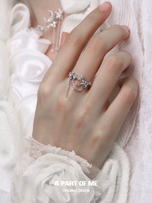 Elegant A PART OF ME snow rose chain ring on a delicate hand with intricate details