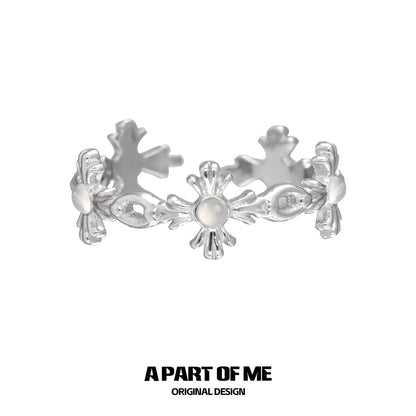 Silver snowflake cross agate ring featuring floral designs for a unique accessory