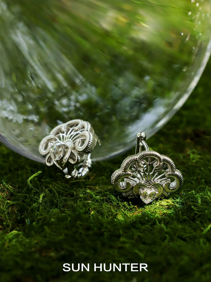 Stylish SUN HUNTER spring lace keychain earrings featuring intricate silver design and sparkling gems