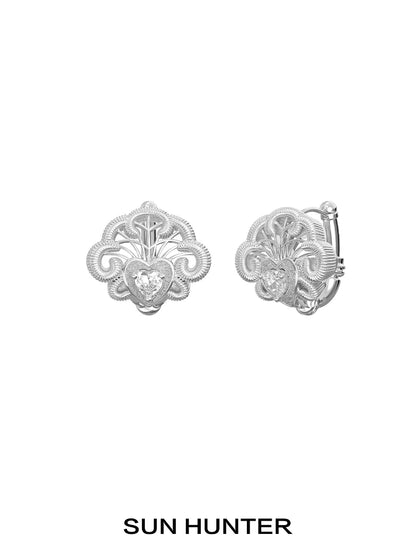 SUN HUNTER spring lace keychain earrings featuring an intricate design with a sparkling gemstone