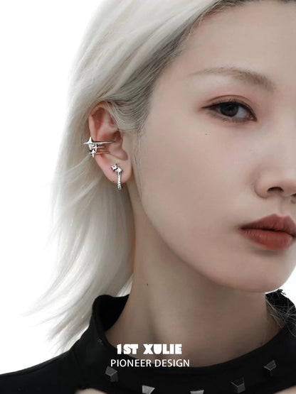 Stylish model wearing star hoop silver earrings featuring a modern design and elegant aesthetic