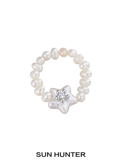 SUN HUNTER star pearl ring featuring shimmering star-shaped pearl with surrounding little pearls