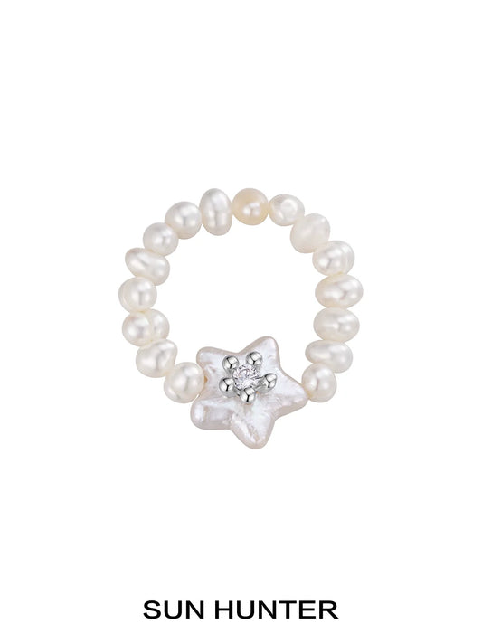SUN HUNTER star pearl ring featuring shimmering star-shaped pearl with surrounding little pearls