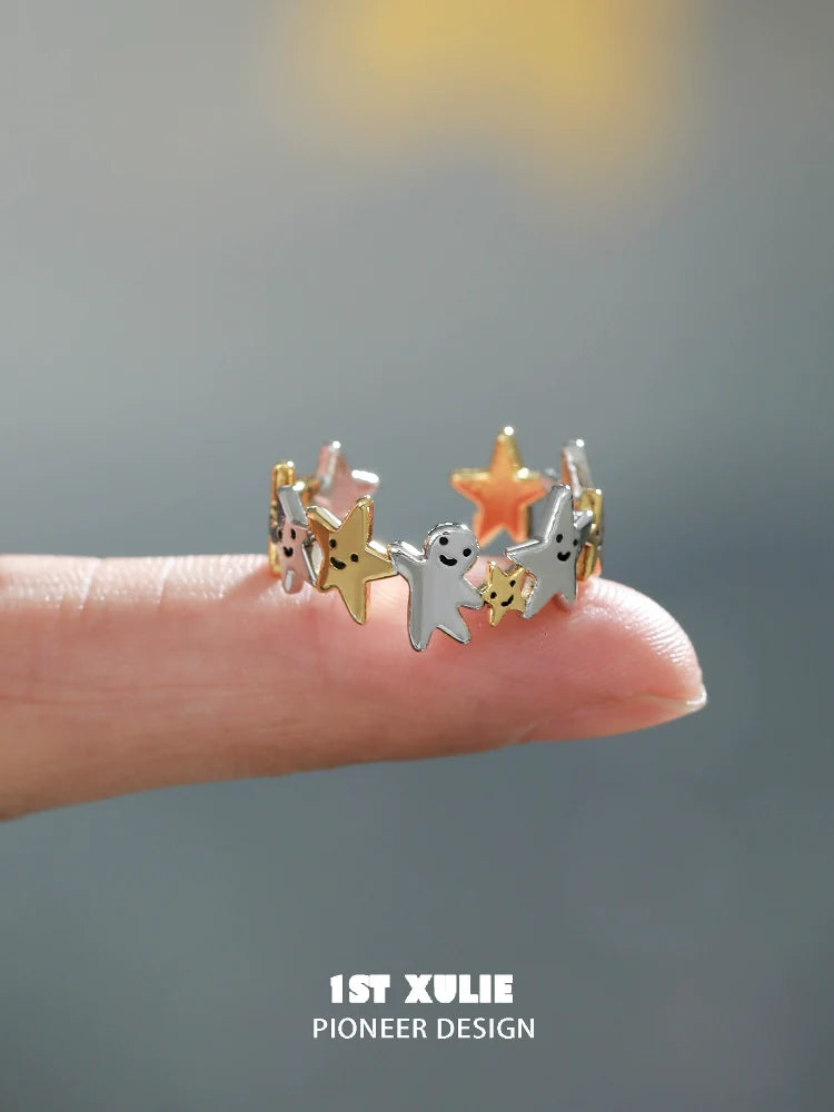 Unique star shaped silver ring featuring colorful star accents for stylish jewelry lovers