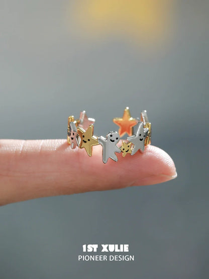 Unique star shaped silver ring featuring colorful star accents for stylish jewelry lovers