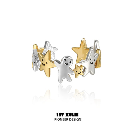 Star shaped silver ring featuring playful star and ghost designs with a mix of gold accents