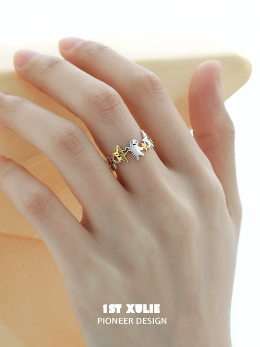 Delicate star shaped silver ring featuring a playful design with colorful star accents