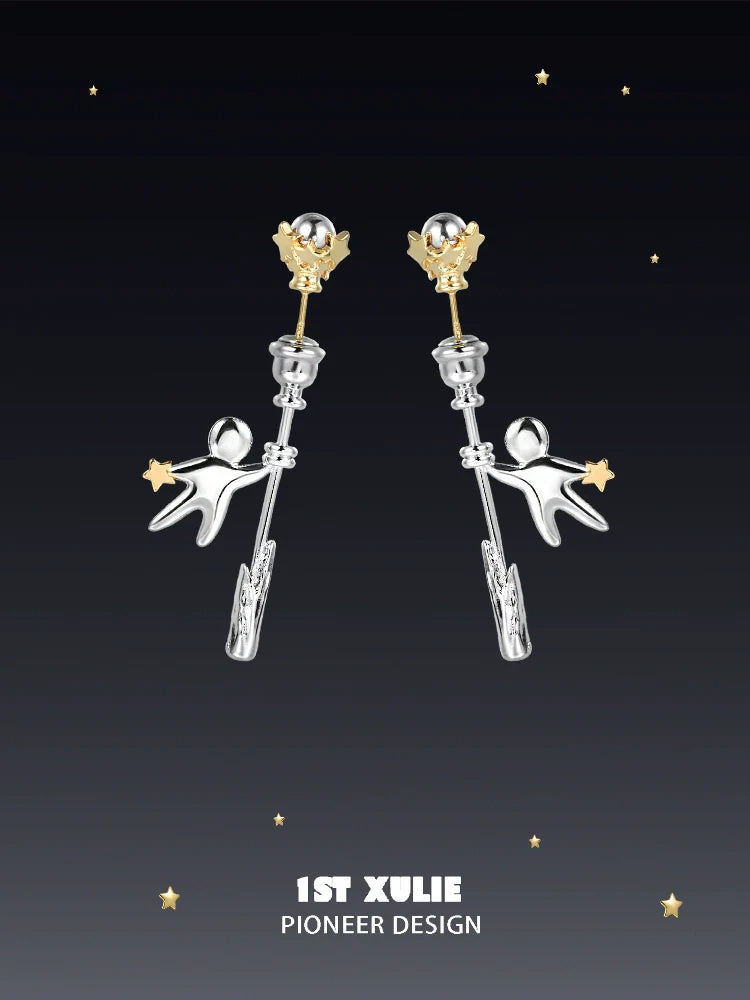 Unique 1ST XULIE star stud earrings featuring playful astronaut design and gold accents
