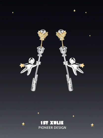 Unique 1ST XULIE star stud earrings featuring playful astronaut design and gold accents