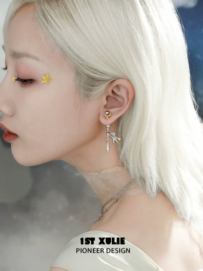 Stylish star stud earrings by 1ST XULIE showcased on a model with silvery blonde hair