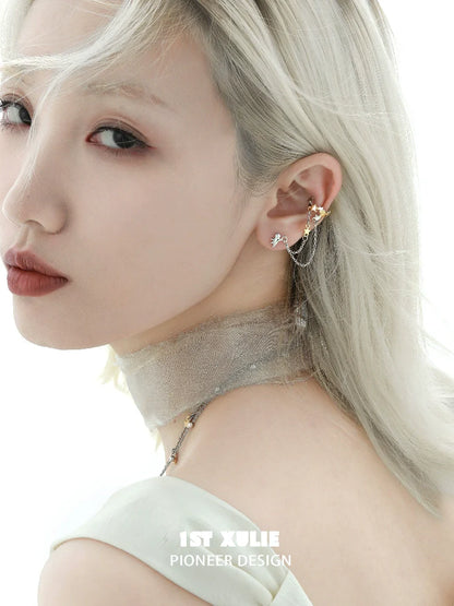 Fashionable starlight ear cuff with elegant design worn by a model with light hair