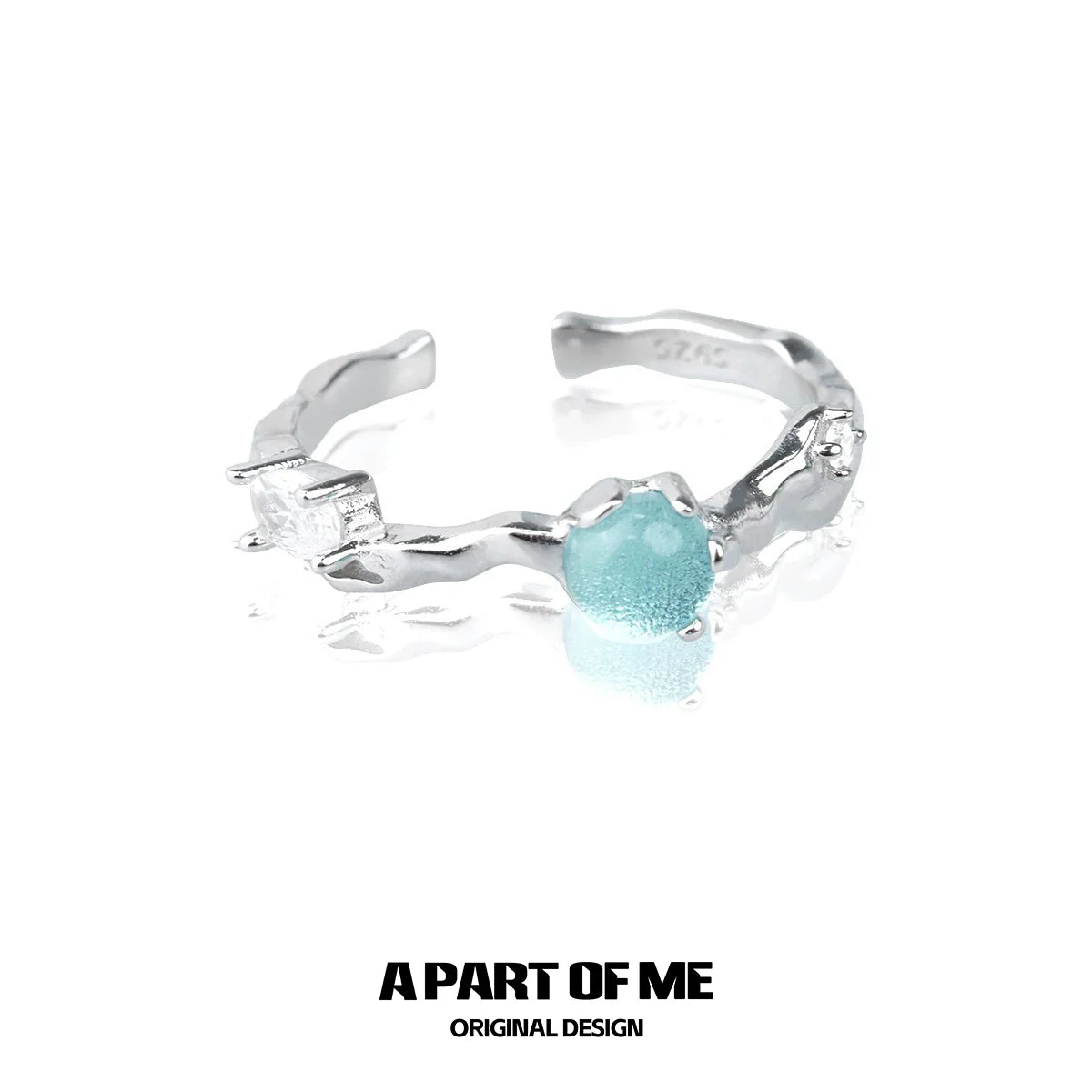 A PART OF ME blue gemstone statement ring with a unique silver design and sparkling accents