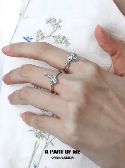 Elegant summer rose ring from A PART OF ME featuring intricate design and light blue gemstone