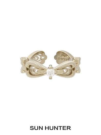 SUN HUNTER bow lace ring with intricate design and clear gemstone centerpiece for stylish accessories