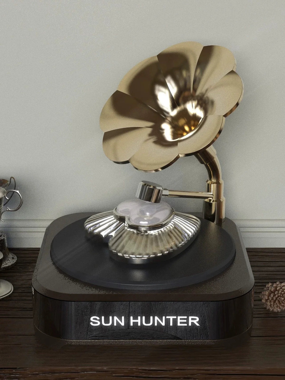 SUN HUNTER butterfly mother-of-pearl ring displayed on a vintage-style gramophone