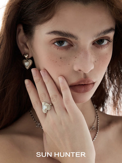 Elegant butterfly mother-of-pearl ring worn by a model showcasing its intricate design and shine