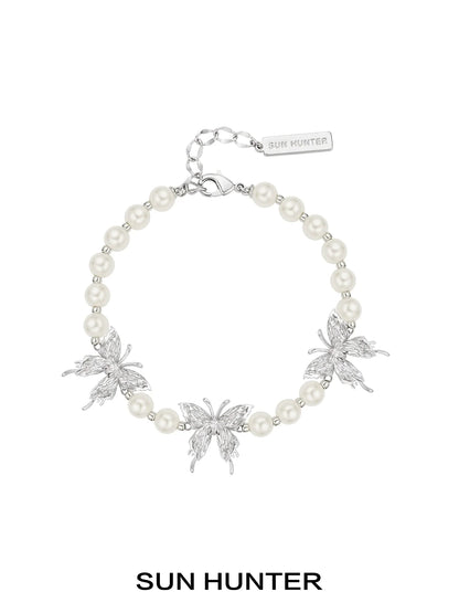 SUN HUNTER butterfly pearl bracelet with silver butterfly charms and elegant pearl beads
