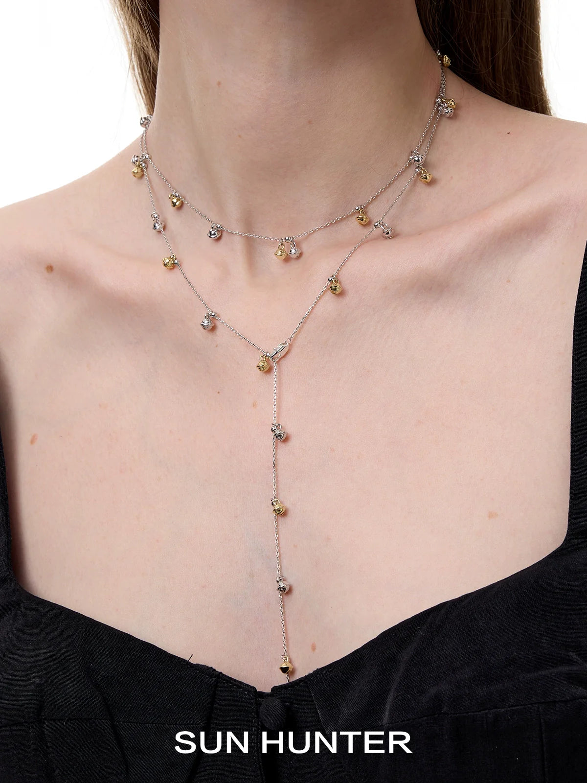 Elegant SUN HUNTER jewelry golden bell pendant necklace for women with delicate design and sparkling accents