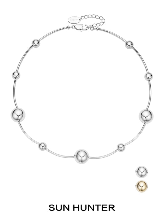 Sun Hunter jewelry planet silver necklace for women featuring a minimalist design with metallic spheres