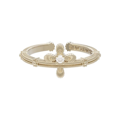 Elegant SUN HUNTER lace cross ring featuring intricate detailing and a sparkling center stone