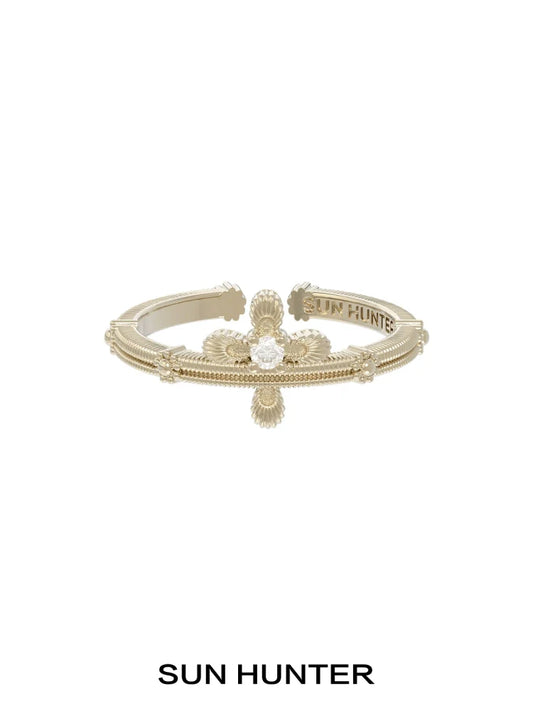 Elegant SUN HUNTER lace cross ring in gold with intricate detailing for a timeless accessory