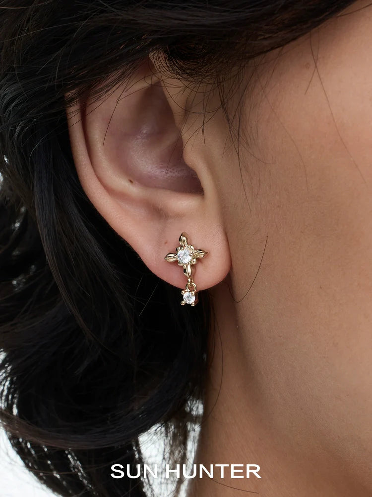 SUN HUNTER Maillard Iris stud earrings set featuring elegant floral design with sparkling gemstones