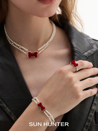 SUN HUNTER Velvet butterfly heart ring paired with pearl bracelet and necklace for elegant style