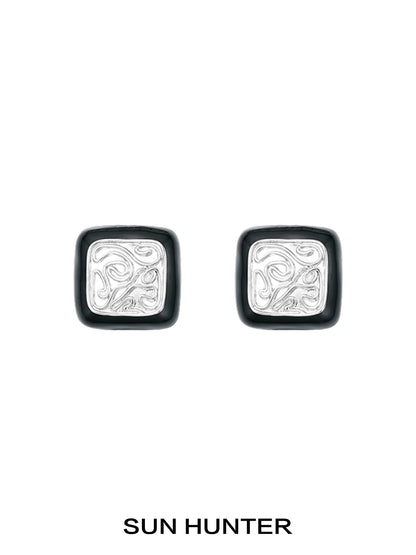Elegant vintage coin stud earrings by SUN HUNTER with intricate silver designs and a classic look