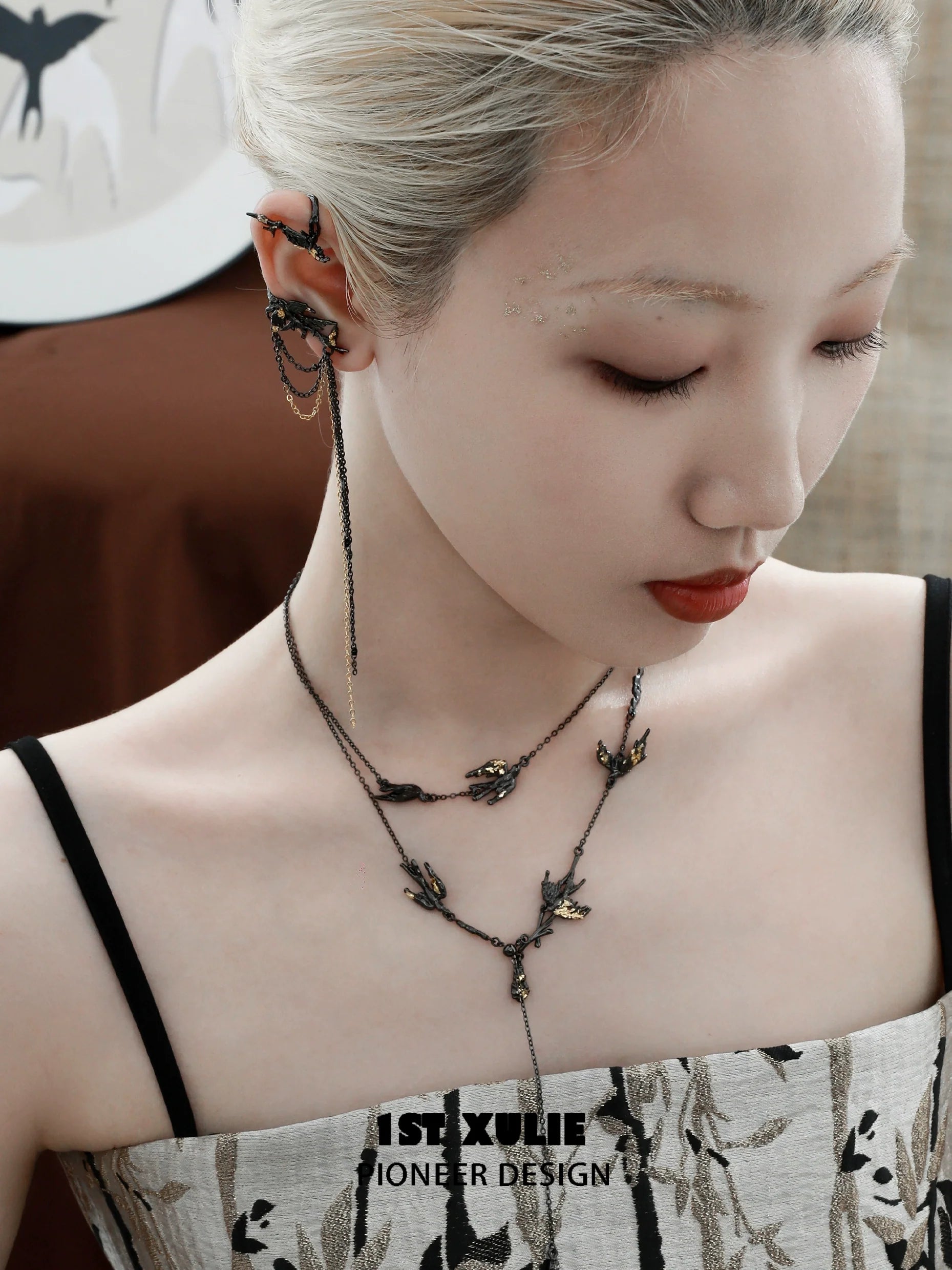 Elegant swallow ear clips jewelry design showcased on a model with intricate detailing