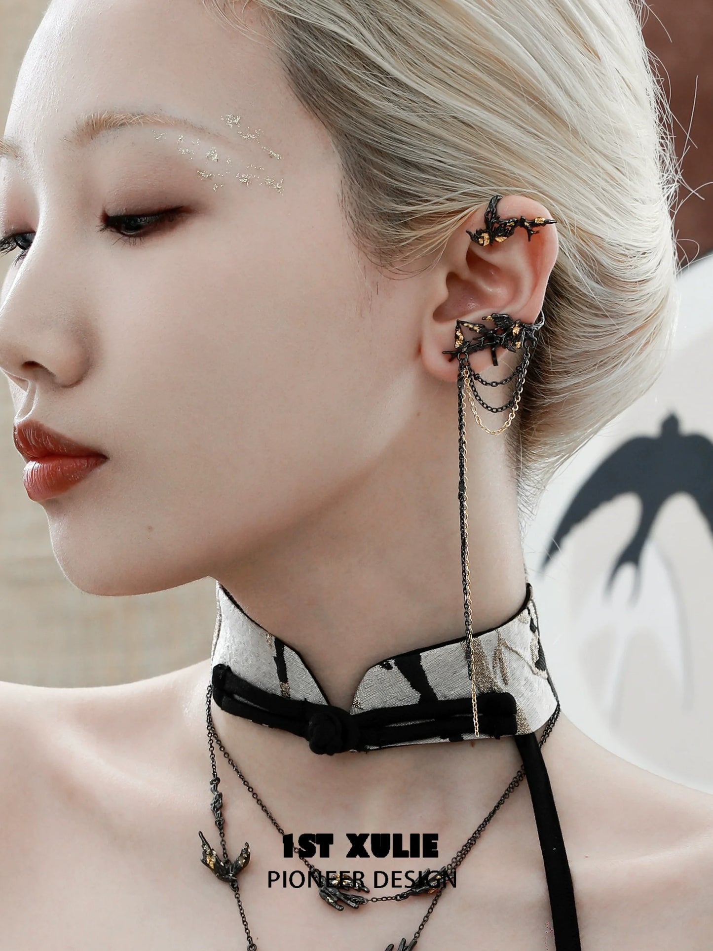 Stylish swallow ear clips by 1STXULIE showcased on a model highlighting unique design and elegance